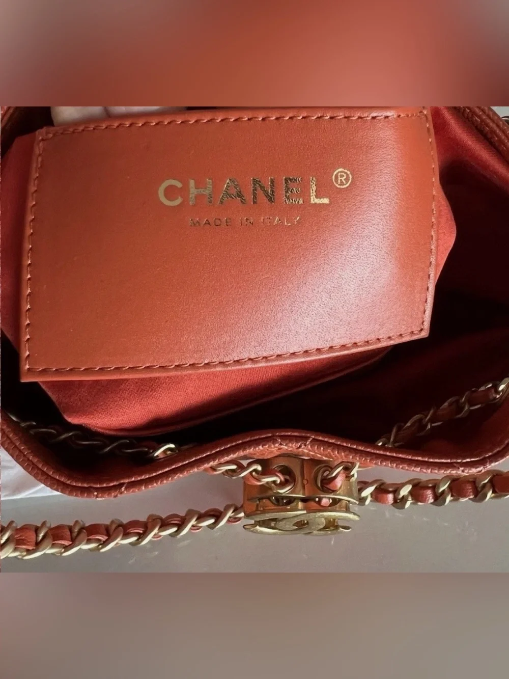 CHANEL Orange Quilted Drawstring Shoulder Bag with Gold Chain